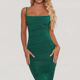 Oh Polly's Sierra Skye wearing the You're My Type Midi Dress in Green Slinky fabric perfect for summer garden parties