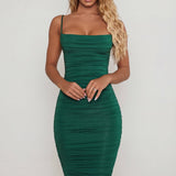 Oh Polly's Sierra Skye wearing the You're My Type Midi Dress in Green Slinky fabric perfect for elegant dinner dates