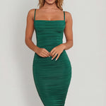 Oh Polly's Sierra Skye wearing the You're My Type Midi Dress in Green Slinky fabric perfect for elegant dinner dates
